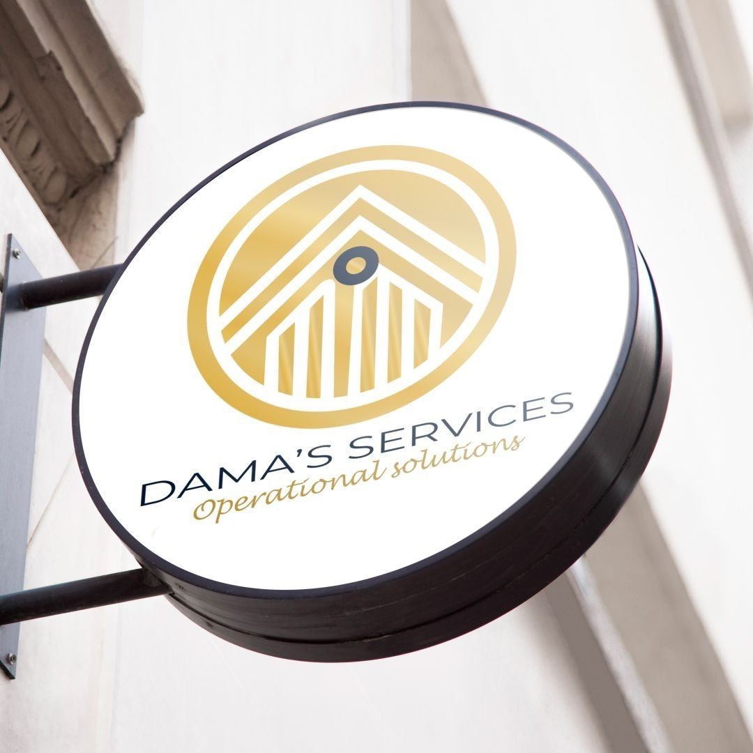 Company sign for Dama's Services with a gold logo on a building wall.